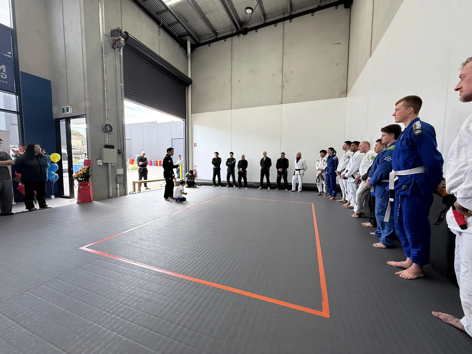 A class lined up on the mat at Noble Grounds BJJ in Mitcham