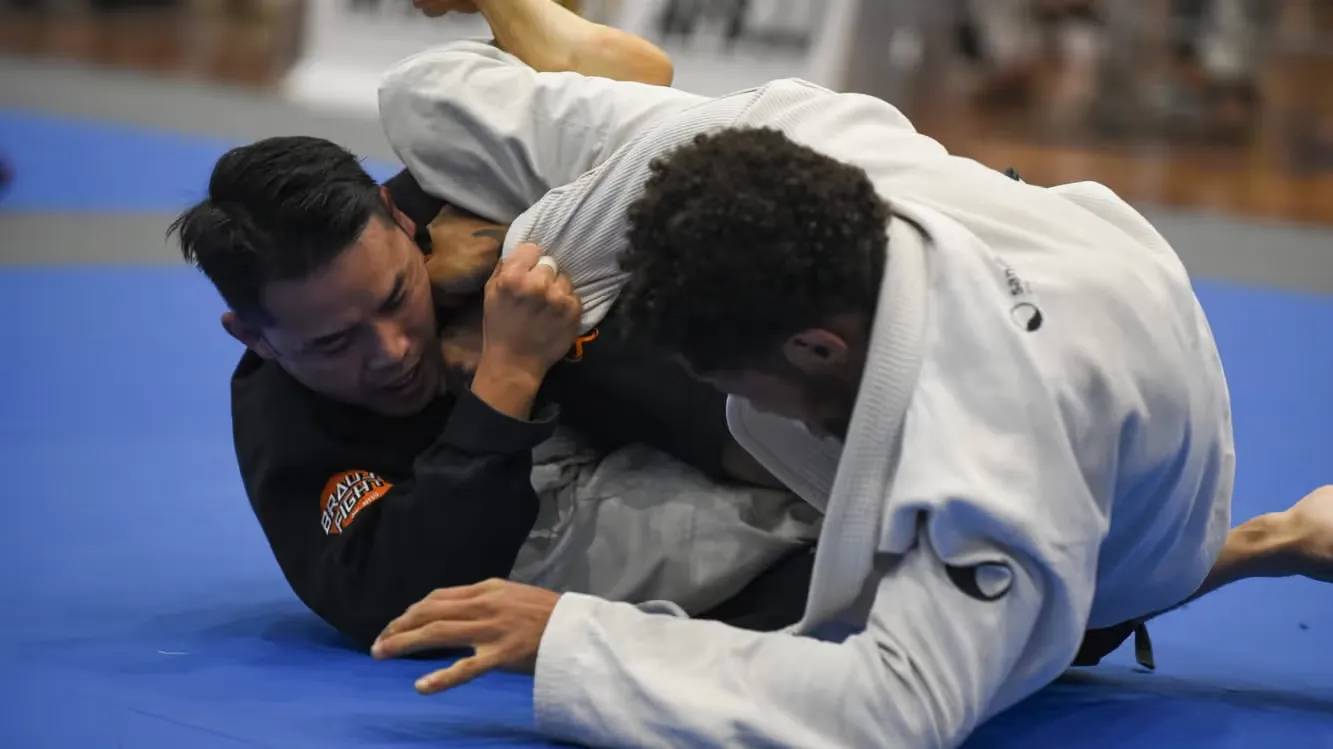 Jason Ng passing the guard during a Brazilian Jiu Jitsu competition match